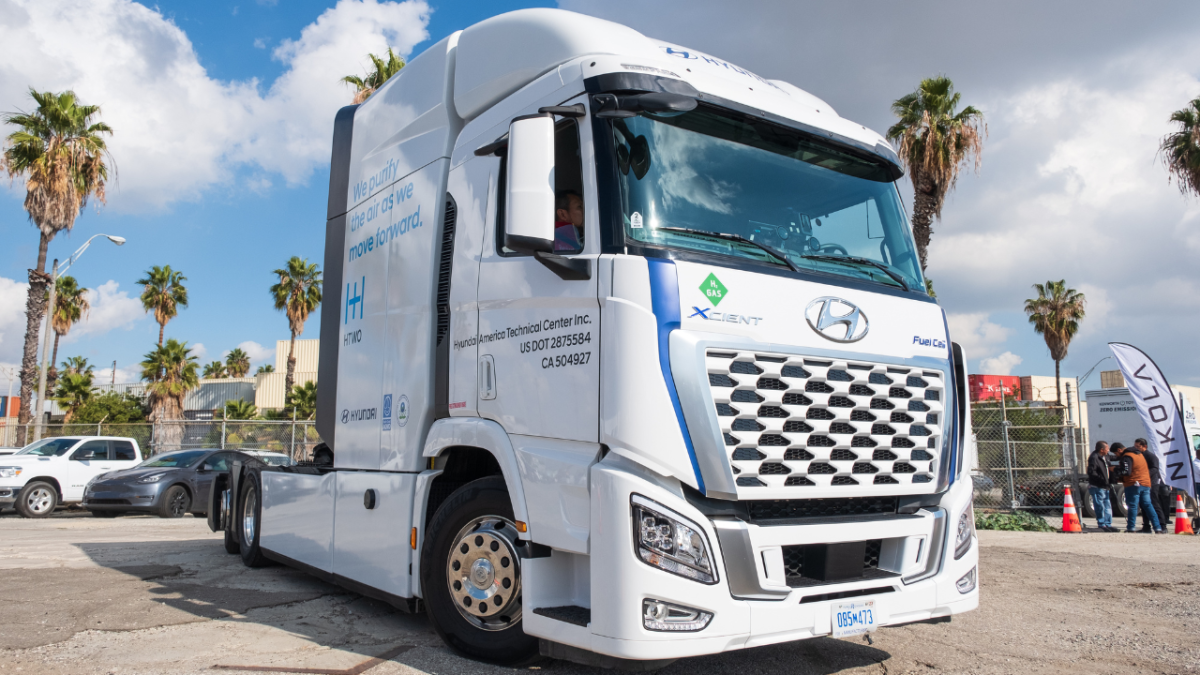 A white ZEV prototype sits in the parking lot.