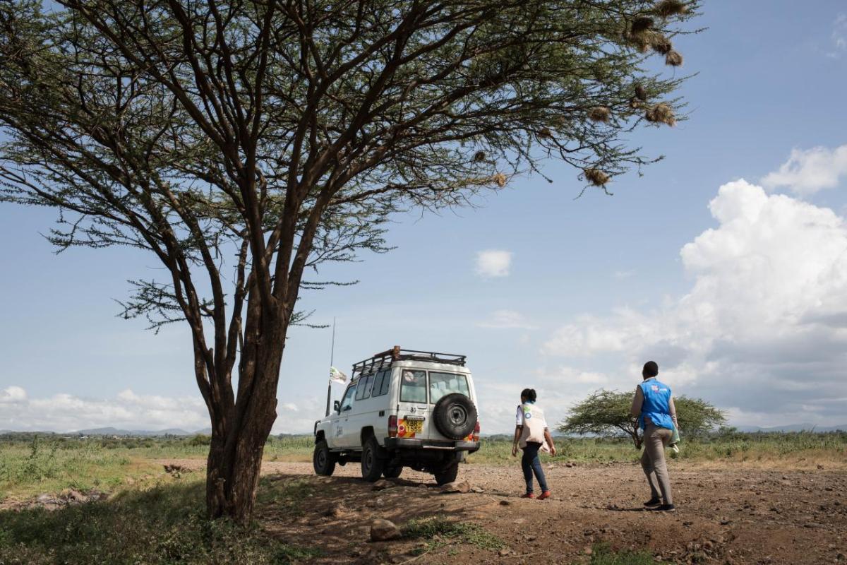 Magdalene, community health volunteer, and Leah, nutrition project officer of Action Against Hunger, walk towards the houses of the Turkana tribe to do nutrition screening to children under five in the rural area of Isiolo County