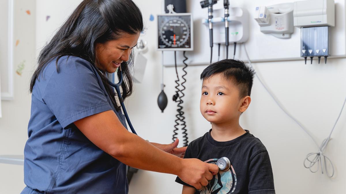 Caption: A healthcare worker at Mālama I Ke Ola health center provides services to a young patient. The health center received a $1 million grant from Direct Relief to continue and expand vital health services to the community after devastating wildfires broke out last August. (Courtesy photo)