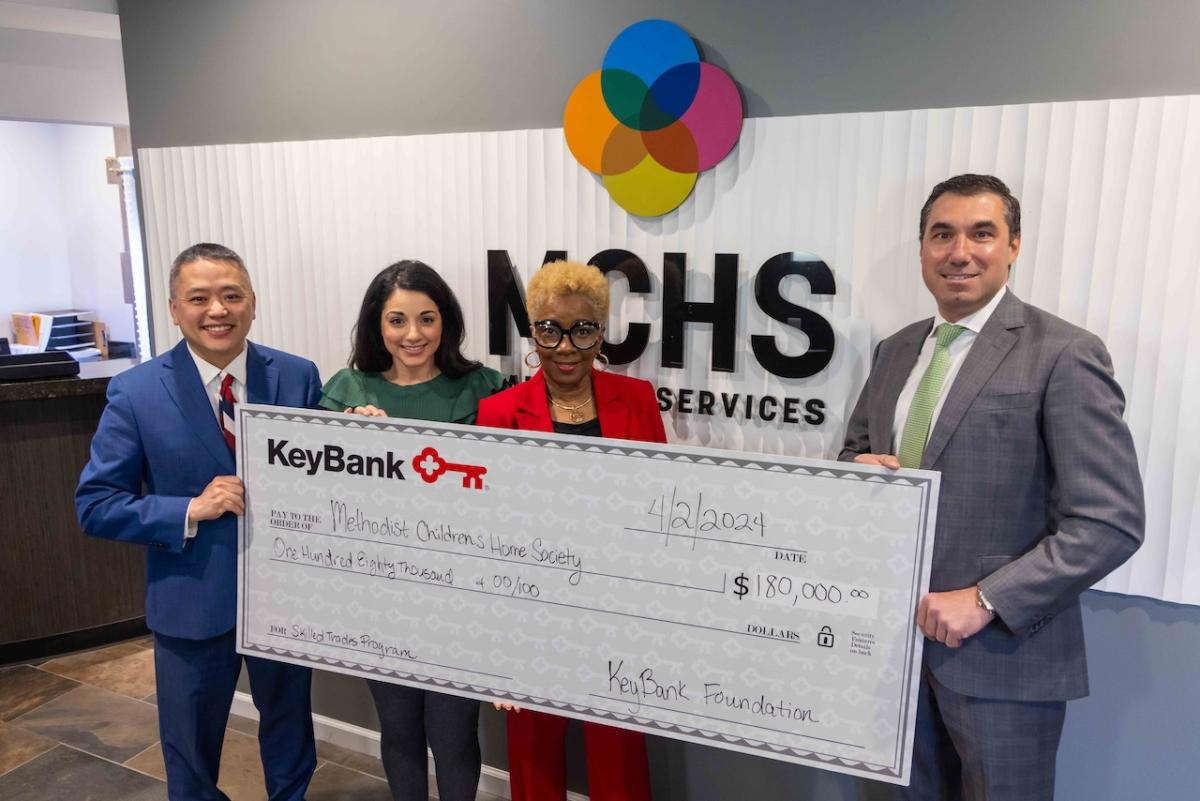Team Members from MCHS and KeyBank shown with a $180,000 grant check.
