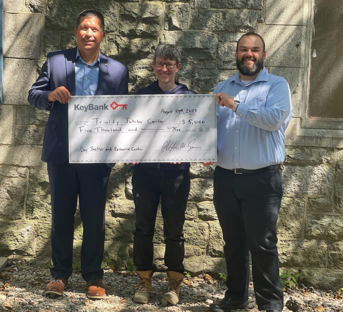 KeyBank and Maine Trinity Jubilee Center leaders shown with grant check.