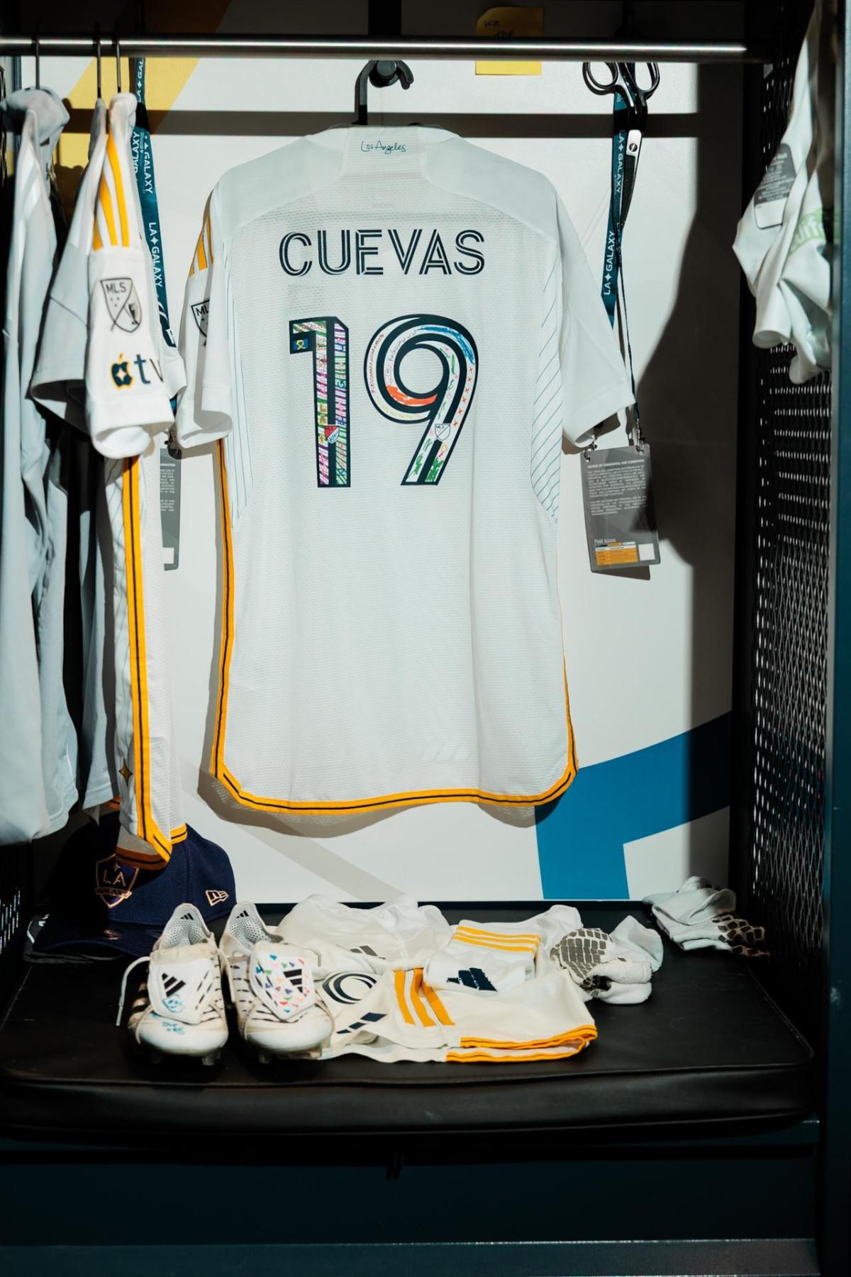 LA Galaxy's Mauricio Cuevas's decorated jersey and cleats in the locker room.