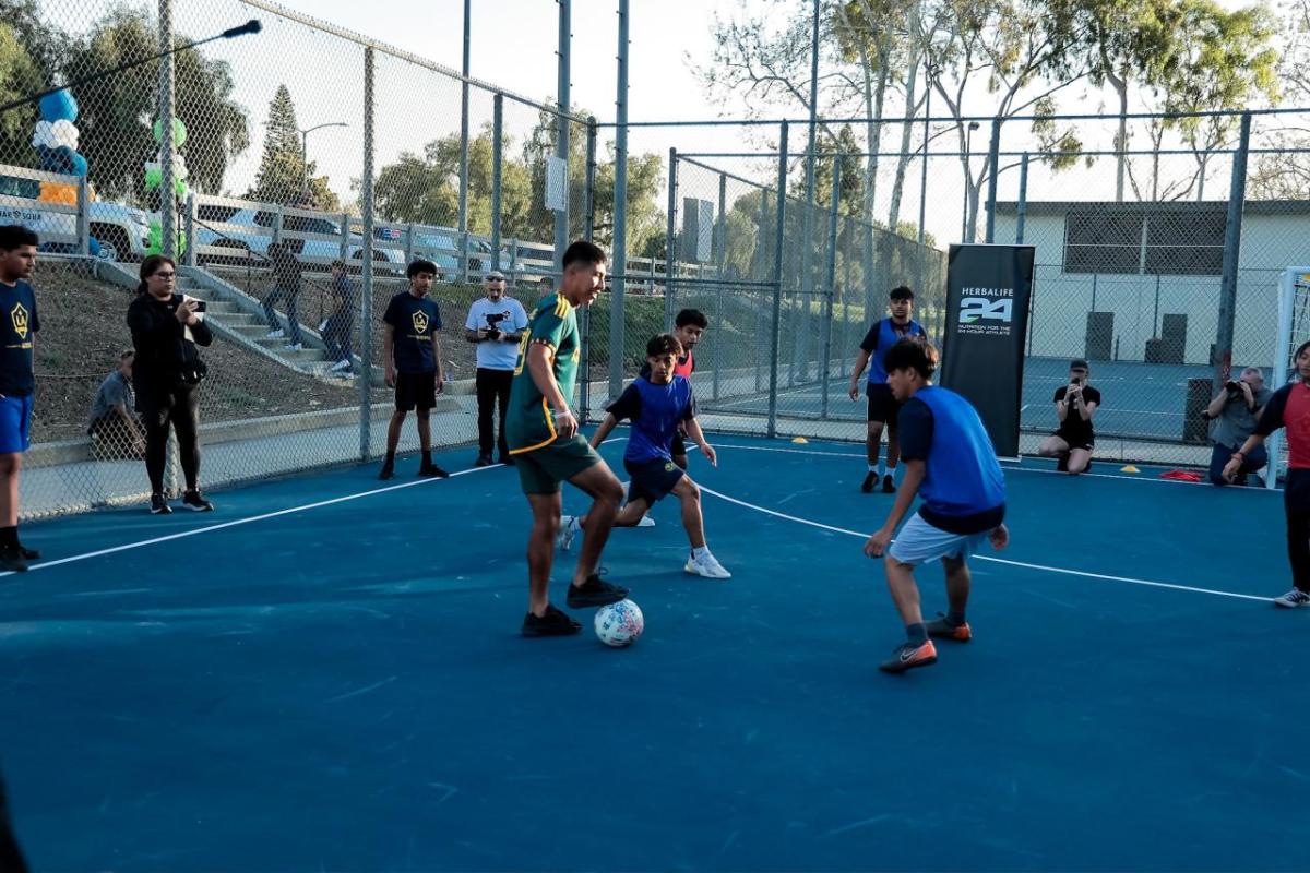 Kids play on the new mini-pitch fields in Long Beach installed earlier this year by AEG's LA Galaxy Foundation, Herbalife, and the U.S. Soccer Foundation.