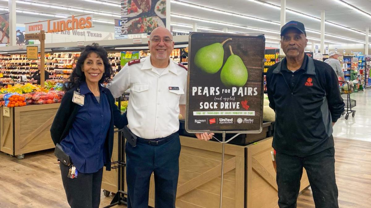 Team members with Pears for Pairs sign