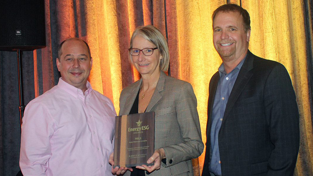 Ed Cimaroli (left), Laurie Wilkins (center) and Shawn Lyon (right) accepted the Energy ESG Award on behalf of MPLX. Ed Cimaroli (left), Laurie Wilkins (center) and Shawn Lyon (right) accepted the Energy ESG Award on behalf of MPLX.