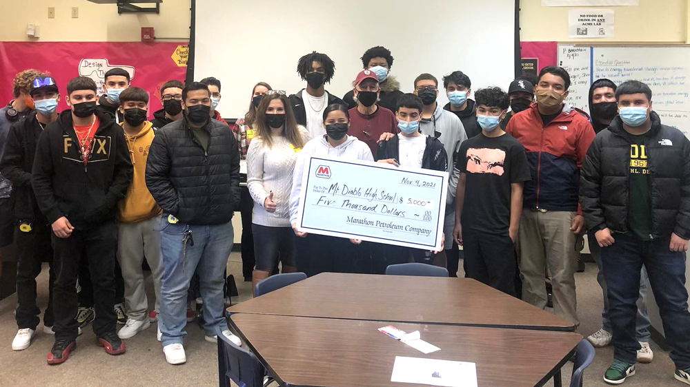 Students and teachers receiving $5,000 check