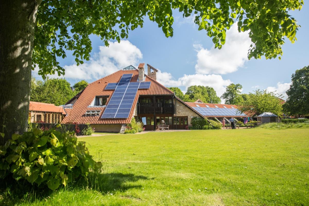 Martin House with grass in front on sunny day