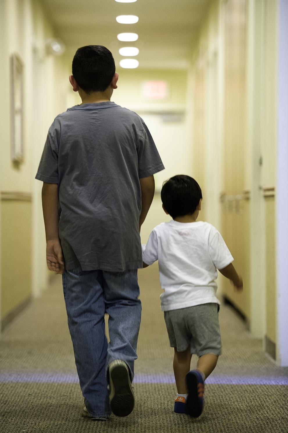 Big brother and little brother walking 