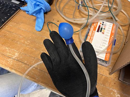 Glove with balloon