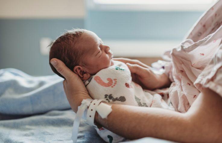 Mother holding a newborn baby.