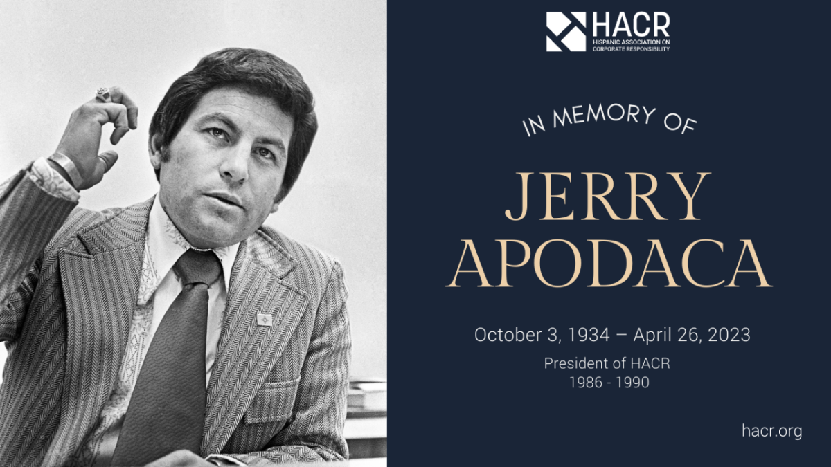 The photo depicts Jerry Apodaca when he served in the New Mexico Senate sometime between 1966 and 1974. Black and white photo of man in his 40s wearing a suit and tie holding his right arm up with Hispanic Associaiton on Corporate Responsibility logo and the words, "In Memory Of, and Jerry Apodaca and October 3, 1934 - April 26, 2023
