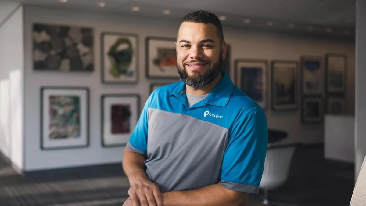 Photo of Micha Greene shown wearing a Principal Financial Group polo.