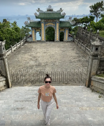 Milica in front of an Asian temple.