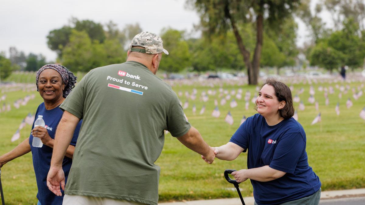 Members of the U.S. Bank Proud to Serve business resource group at a Memorial Day flag-placing event in San Diego earlier this year. " "