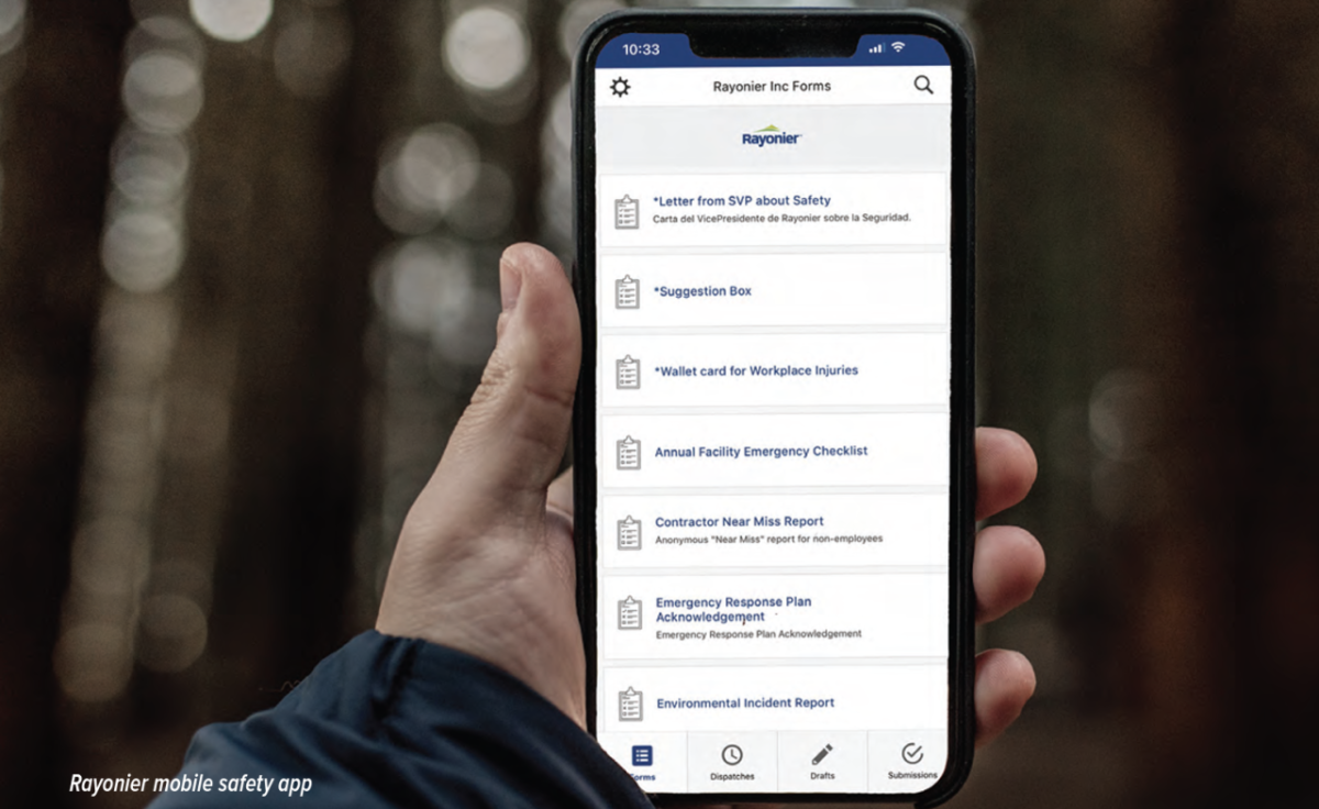 A person holding a mobile phone with the Rayonier mobile safety app open