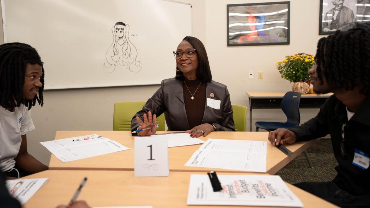 KeyBank and everfi representatives with students.