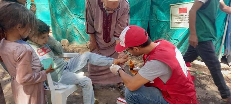 Hundreds of Moroccan Red Crescent volunteers are responding after the recent 6.8 magnitude earthquake that hit Morocco, killing more than 2,900 people and injuring thousands more. (Photo courtesy of Red Cross) Child being treated for injuries