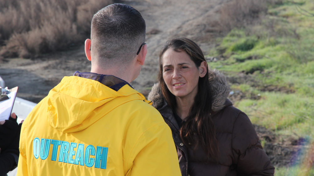 volunteer speaking to woman