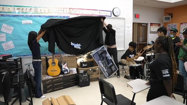 Unveiling the musical instruments at John C. Fremont High School.