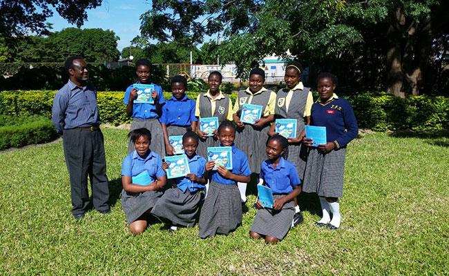 As part of Tetra Tech's STEM Program, Tetra Tech donated its Future Engineering: The Clean Water Challenge book to the girls of the Josephine Fogg School in Kafue, Zambia.