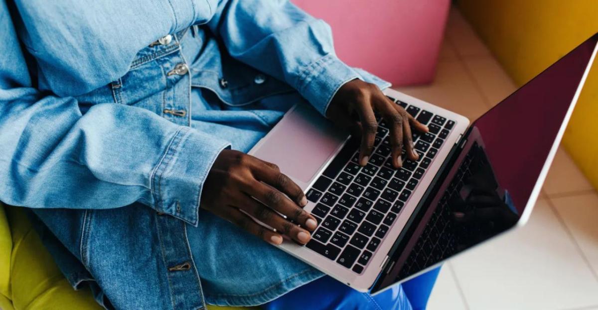 A person typing on a laptop.