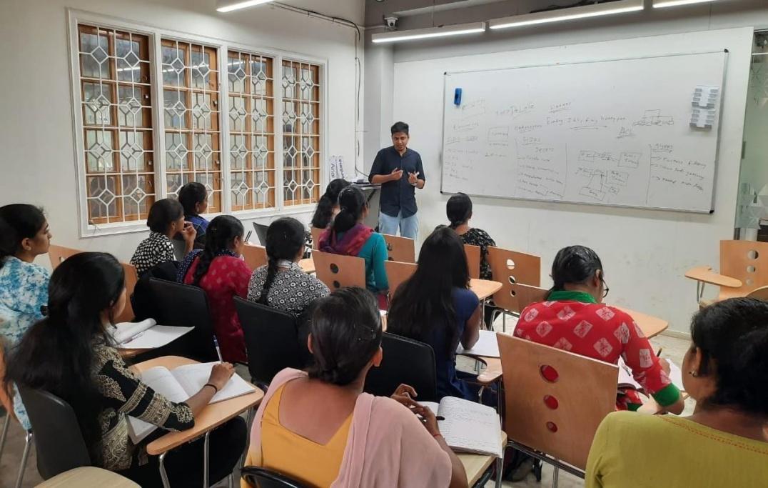 Classroom of women learning from instructor