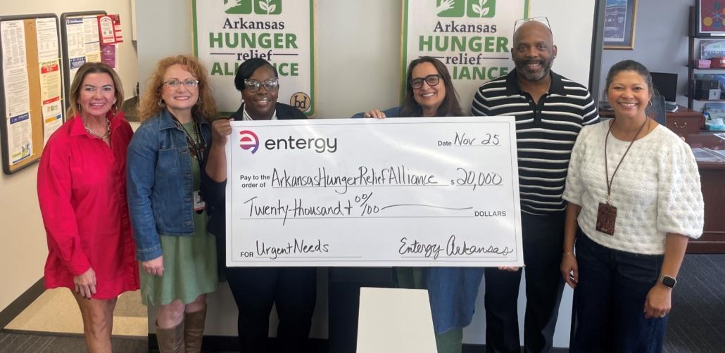 Group photo of people holding up check for Arkansa's Hunger Relief Alliance