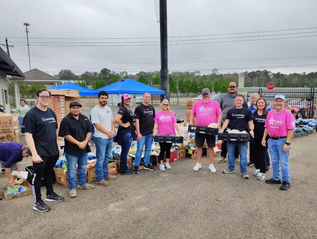 Entergy volunteers distributing food