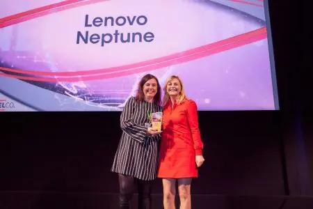Two people posed with an award. "Lenovo Neptune" displayed behind them.