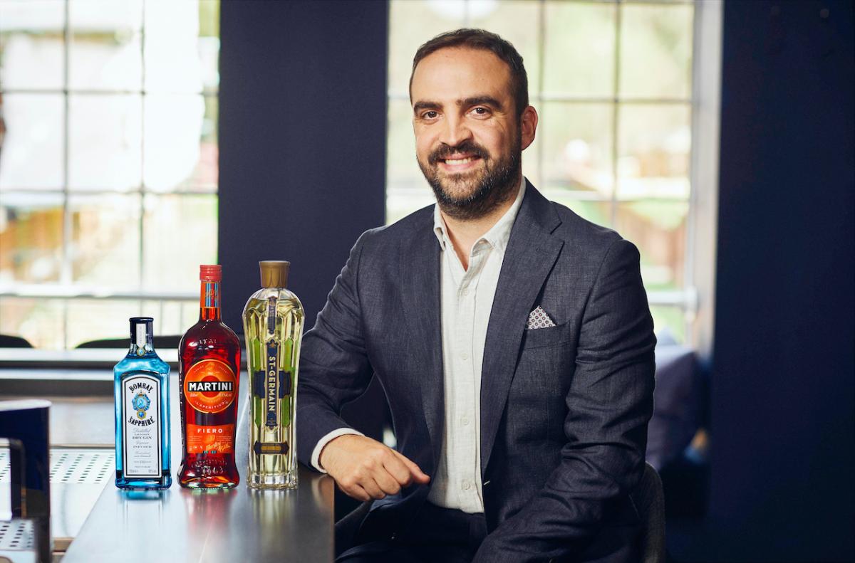 Headshot of Alessandro Garneri next to Bombay Sapphire, Martini, and ST-GERMAIN bottles