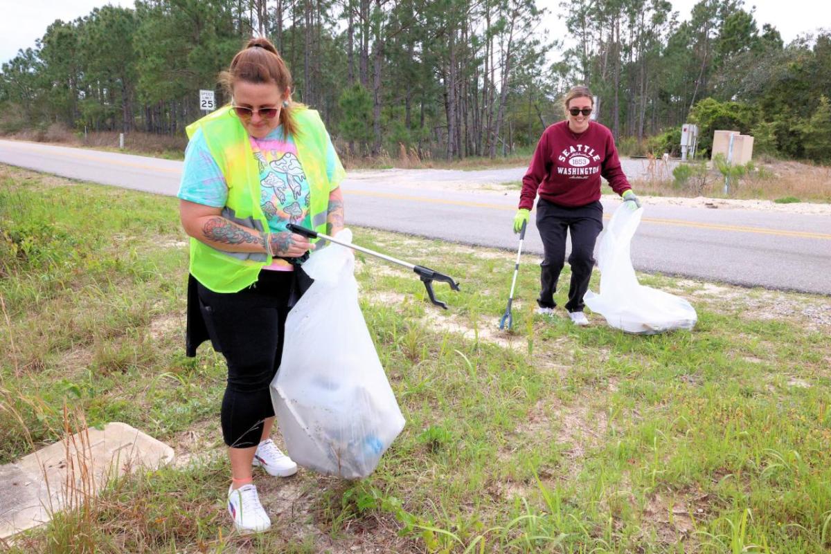 Volunteers pick up trash at AEG Presents and Propellers beach clean up.