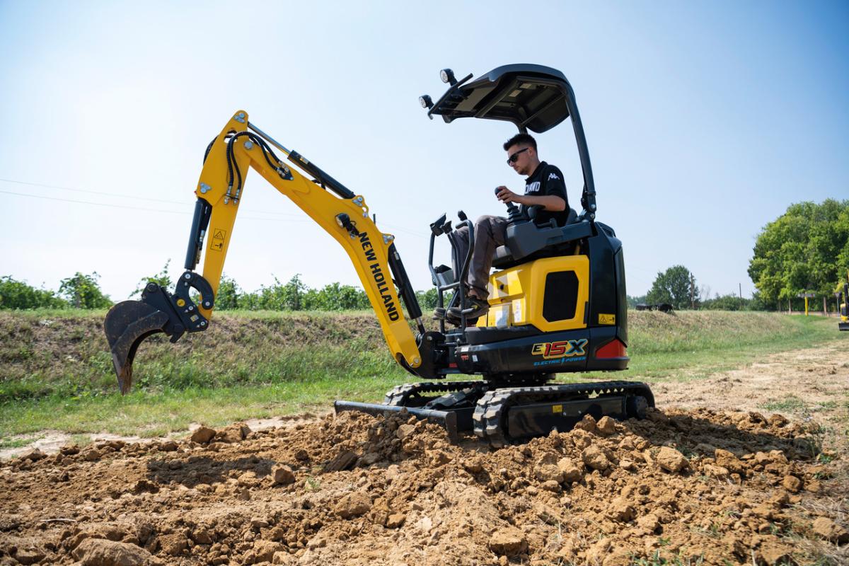 The efficiency of the E15X Electric Power Mini Excavator demonstrates CNH’s firm commitment to a more sustainable future through precision technology A yellow piece of agricultural equipment