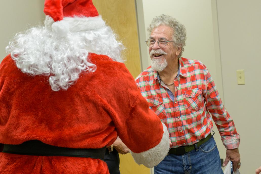 Man shaking hands with Santa