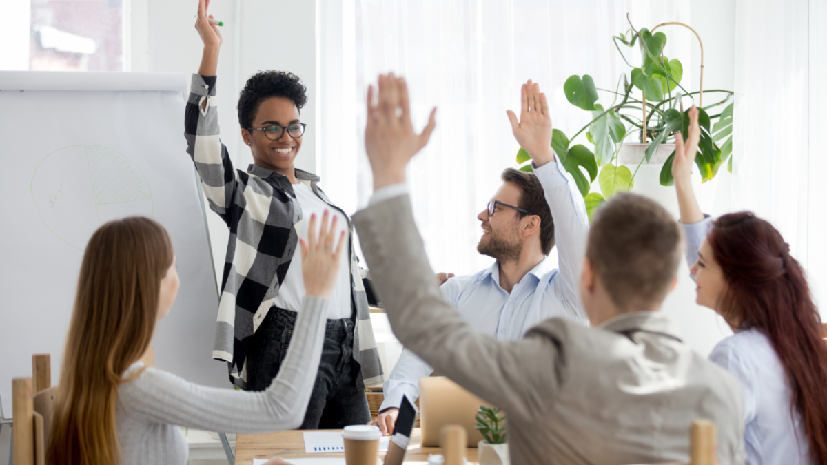 Volunteers raising their hands. 