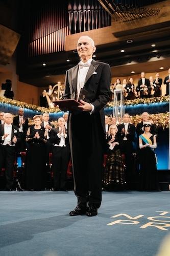 Dr. Moungi Bawendi shown holding the Nobel Prize. 