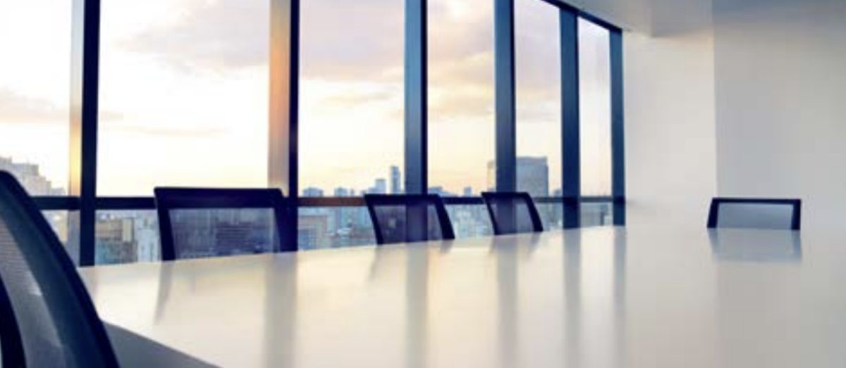 Office table and chairs against a window