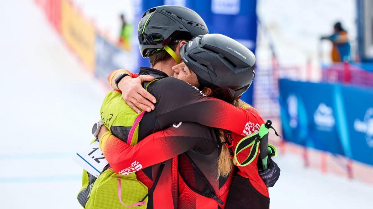 Two athletes hugging