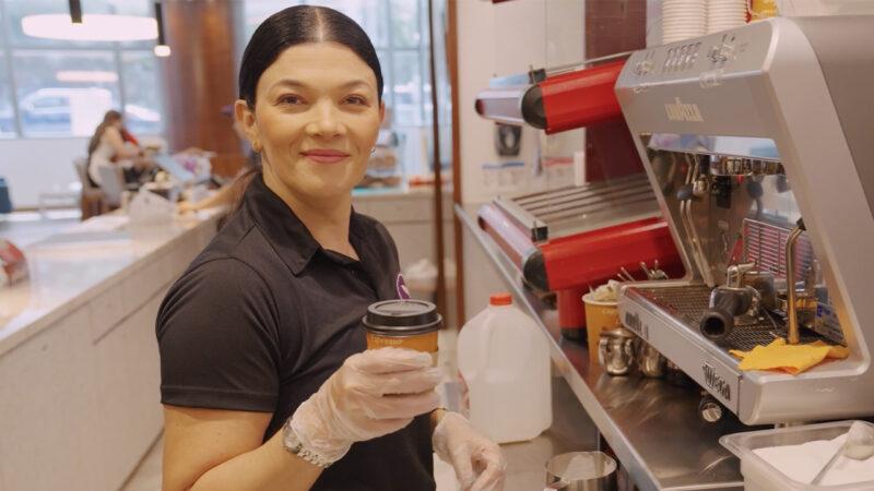 Sara Agudelo, owner of Purple Orchid, received a Wells Fargo Open for Business Fund grant from the Miami Foundation, allowing her to expand her business. Female small businessowner making a coffee in her shop