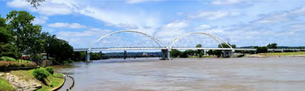 Photo of a bridge in Little Rock, Arkansas, U.S., submitted by an Owens Corning employee. arched bridge over a river