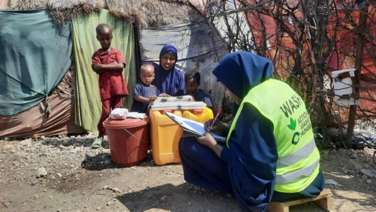 Owliya is visited by an Action Against Hunger staff member at her home after she received a water hygience kit. 
