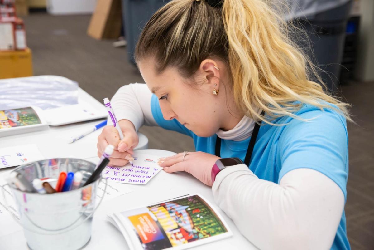 person writing cards