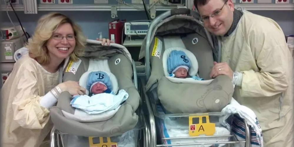 Family with infants in car seats.