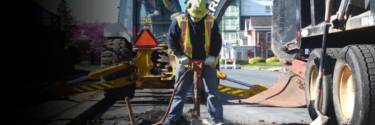 PSEG worker using a jackhammer.