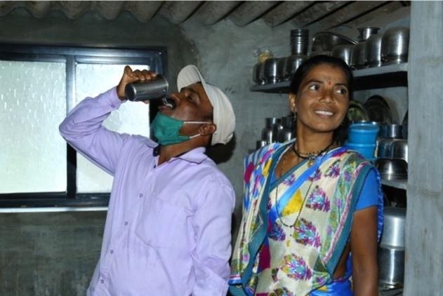 Man drinking water from Aquahome