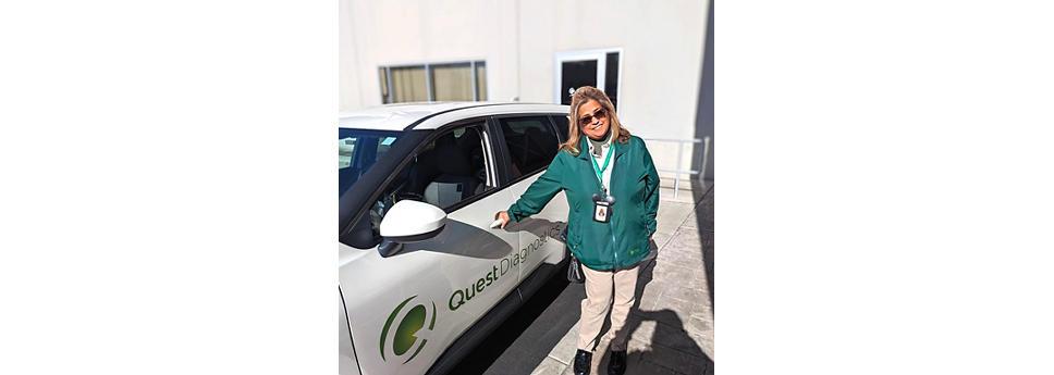 Pauline Chaves stood next to a white car