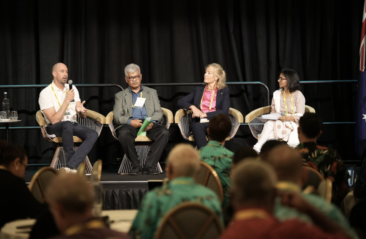 Four people sat on stage having a discussion