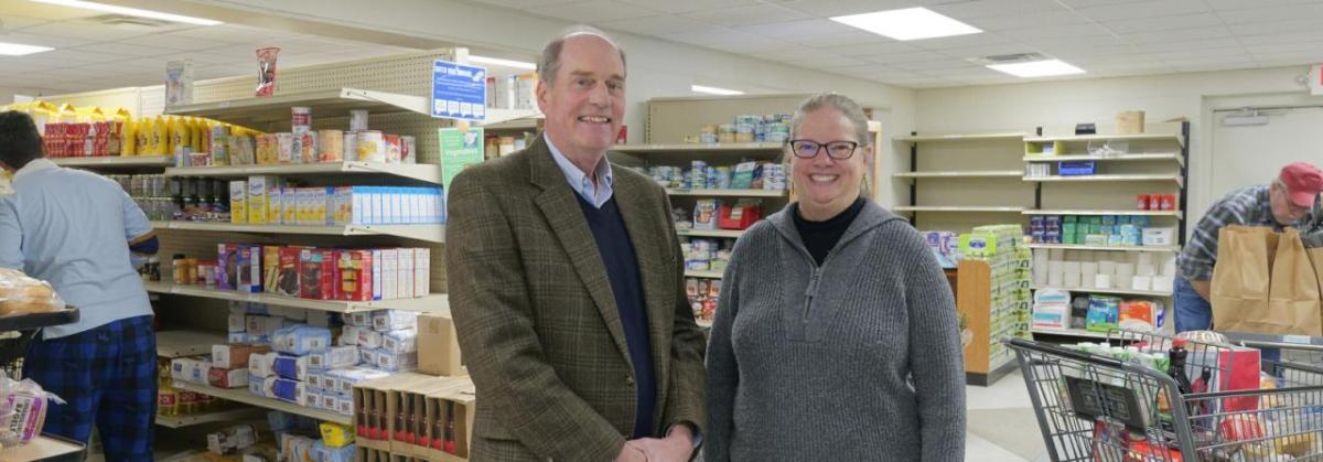 Two people stood inside a supermarket 