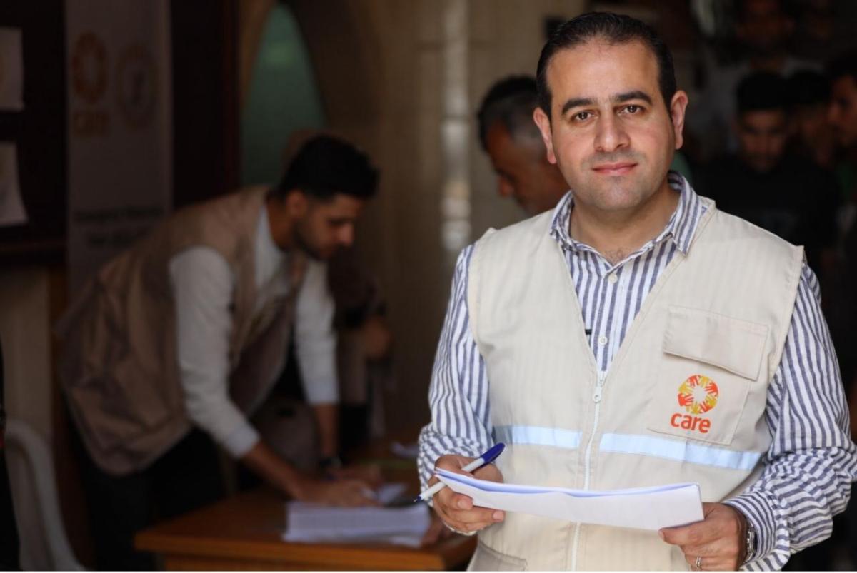 A man in an aid worker vest. 