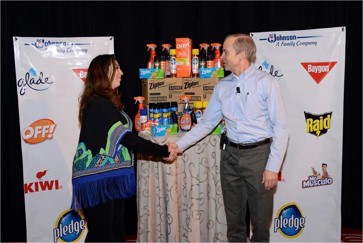 SC Johnson Chairman and CEO Fisk Johnson (right) congratulates Ana Laura Robles Quijano from the Mexican Red Cross during today’s donation announcement. Photo courtesy SC Johnson