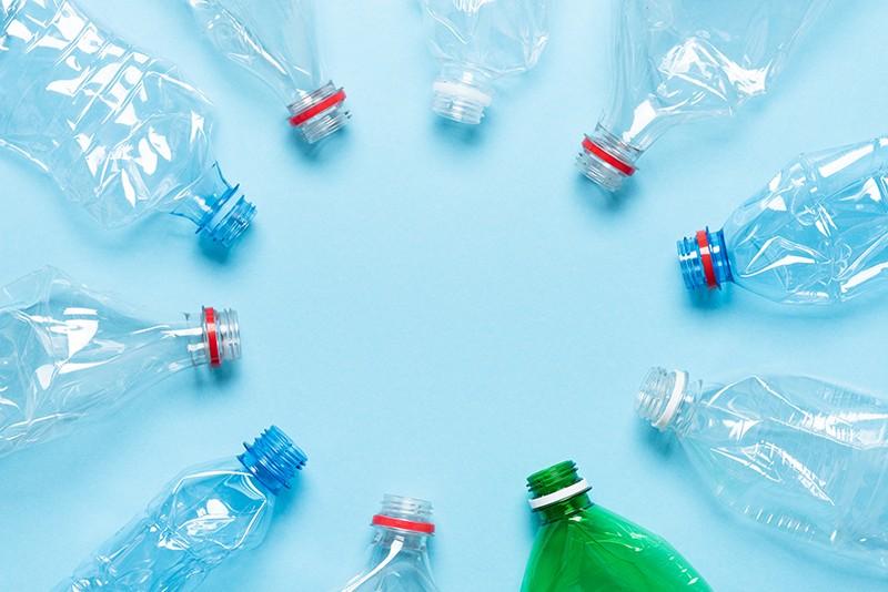 Empty, crumpled, plastic bottles arranged in a circle